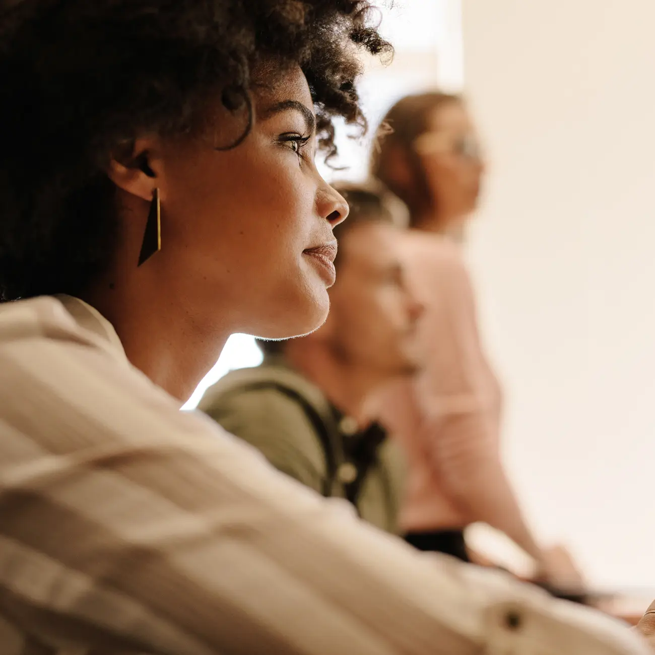 Professional listening attentively during a team meeting.